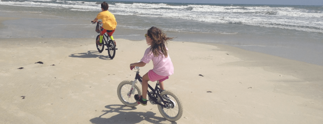 riding bikes on the beach